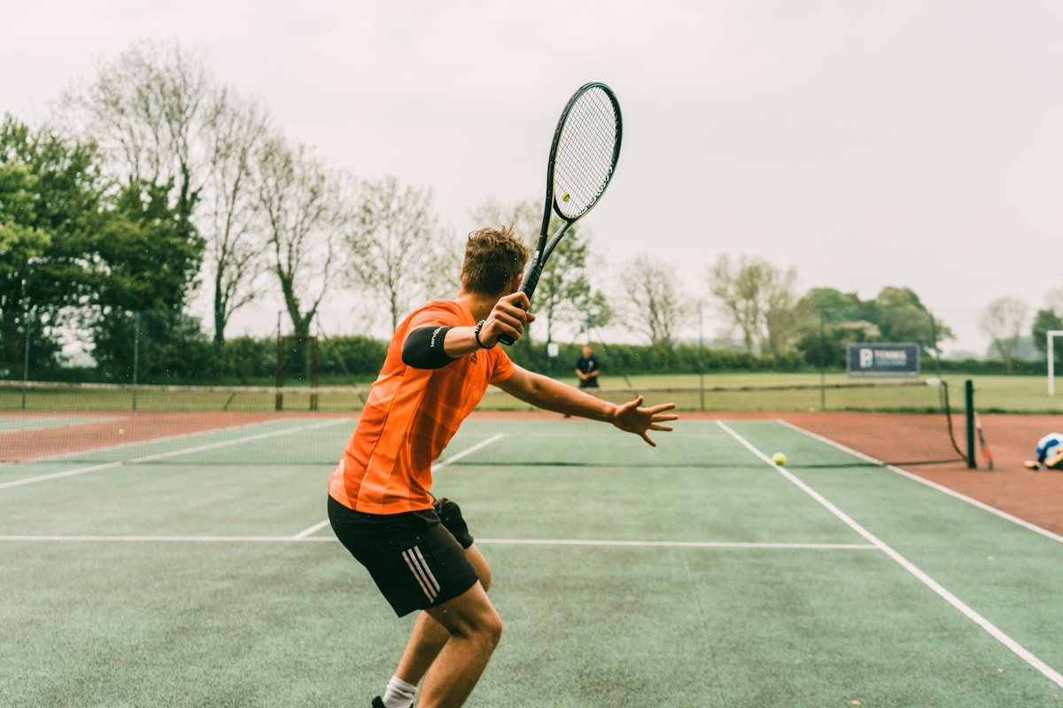 Aerial tennis serve on clay